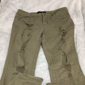 Green ripped jeans